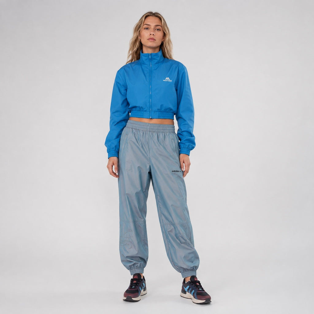 Pantaloni adidas Originals bleu irizați cu logo Trefoil